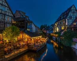 Colmar’s Petite Venise district at night, illuminated half-timbered houses along the canals, near Husseren Collections Apartments in Alsace